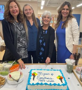 People cutting cake at CPCC 35th Year Anniversary Celebration