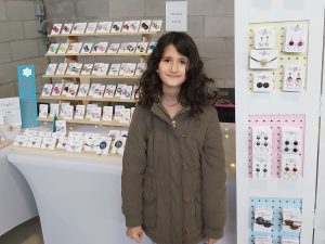 Mikaela D’Alimonte at craft market with fashion accessories