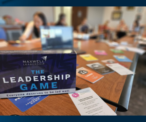 Table with sign for The Leadership Game